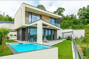 Уникальный современный коттедж в стиле Хай-Те...